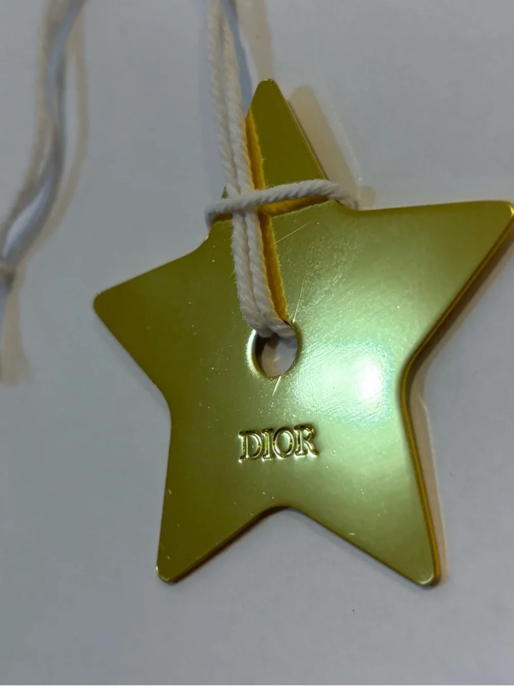 Dior Metallic Gold Star Tag with White Cord